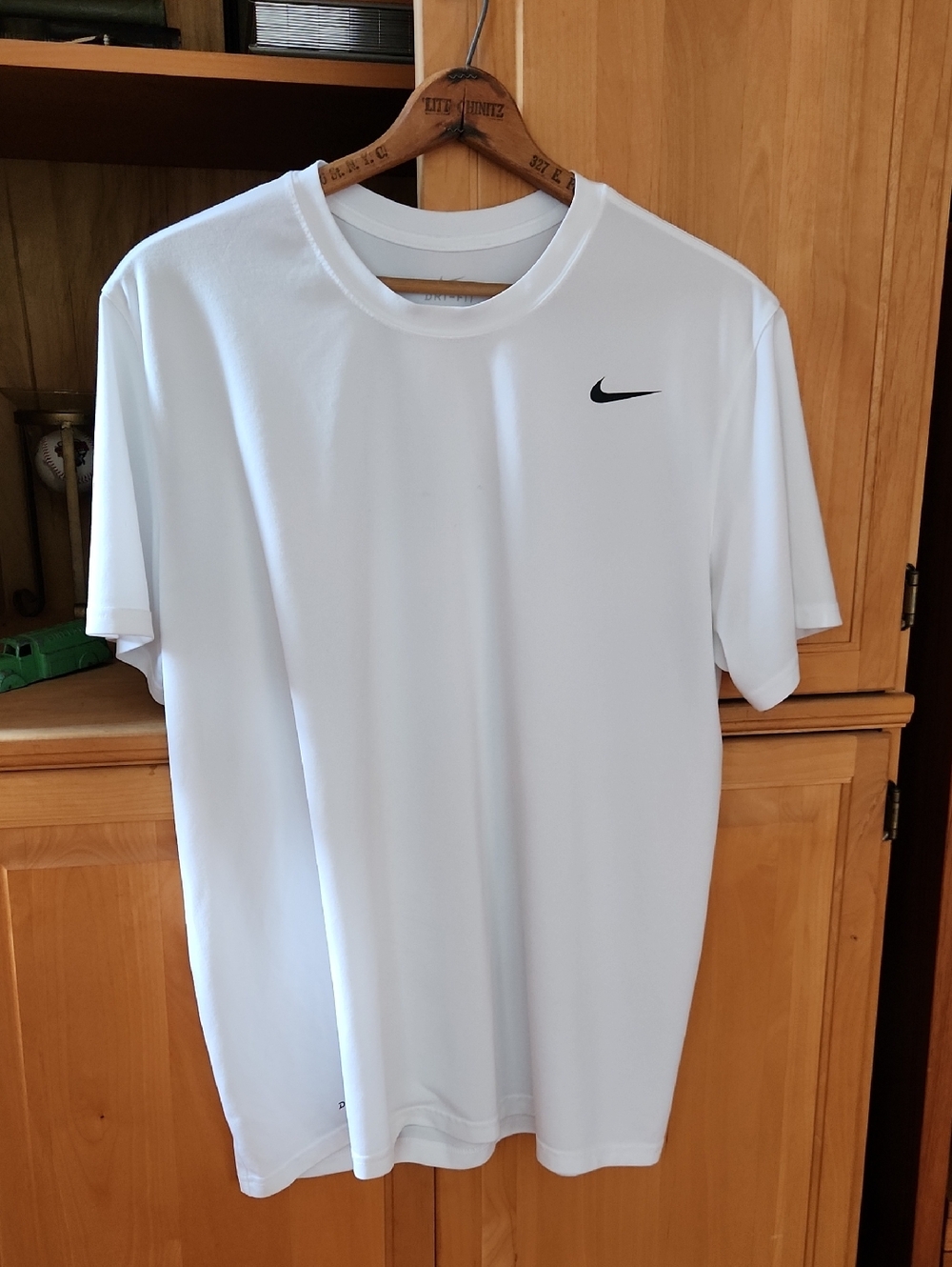 Nike White Short Sleeve Dri-FIT Tee with Black Swoosh